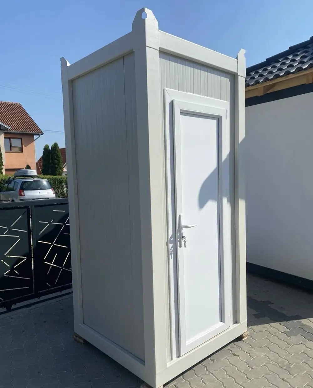 Inside a standard porta potty: seat, urinal and toilet paper
